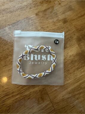 *BRAND NEW IN PACKAGE* Gold Blush Nepal bracelet